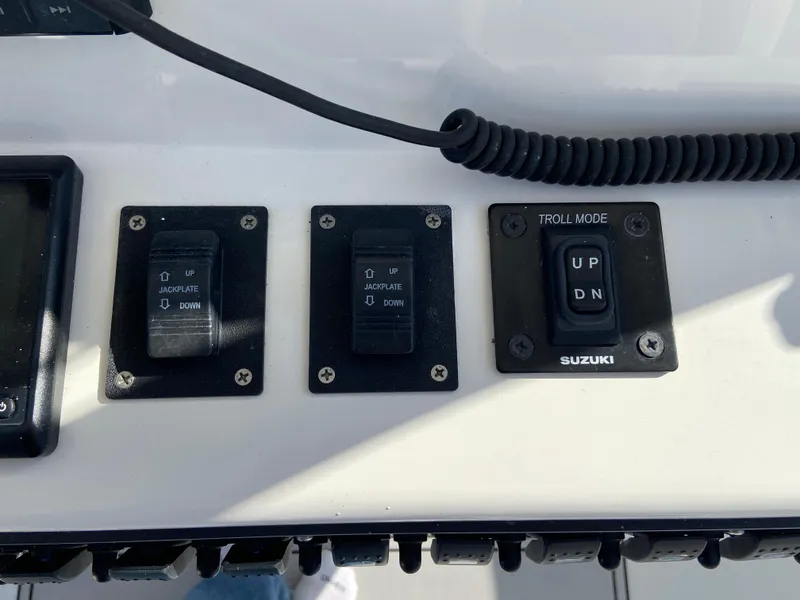 Slide: The Image of Control panel of 2021 Twin Vee 36 Center Console with Suzuki troll mode switches. - 23