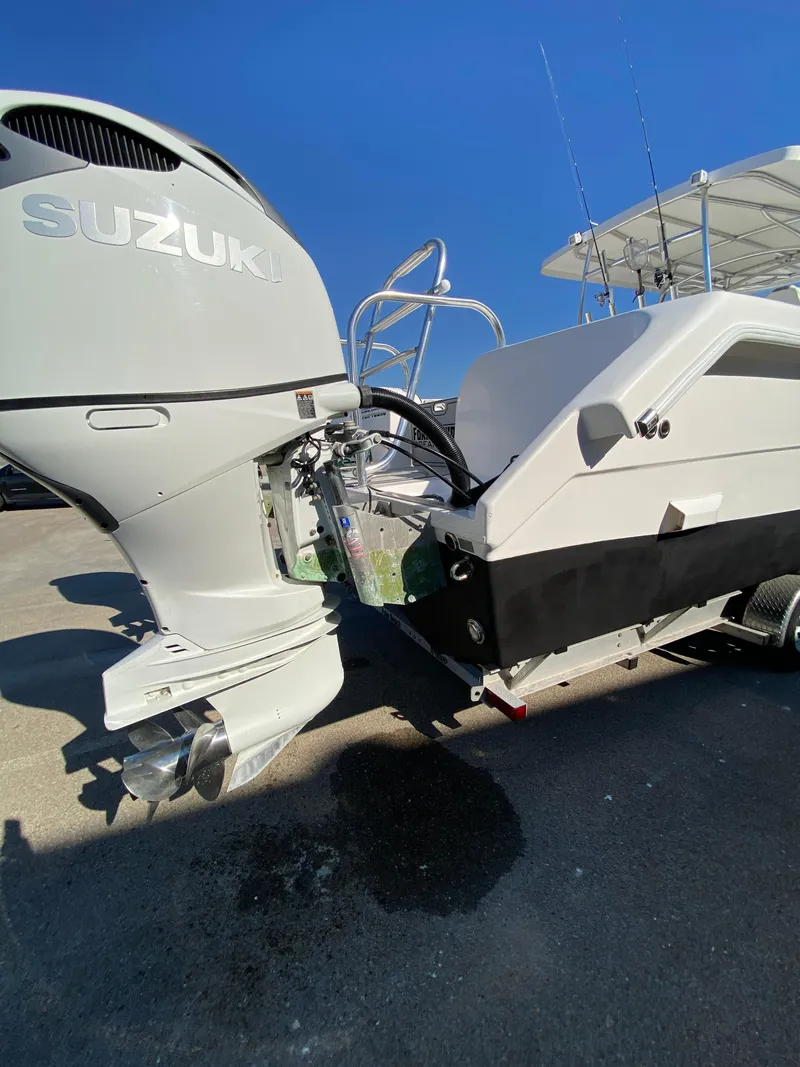 Slide: The Image of 2021 Twin Vee 36 Center Console boat with Suzuki outboard motor, docked on trailer. - 8