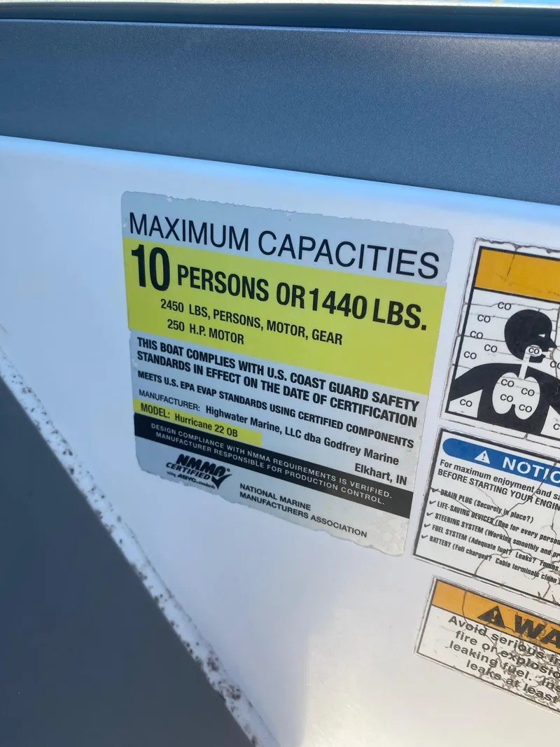Slide: The Image of 2017 Hurricane SunDeck 2200 DC OB boat capacity label, 10 persons or 1440 lbs. - 11