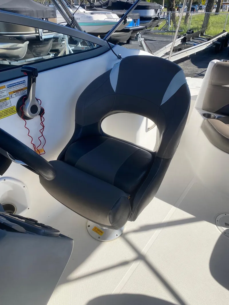 Slide: The Image of Captain's chair on a 2017 Hurricane SunDeck 2200 DC OB boat. - 12