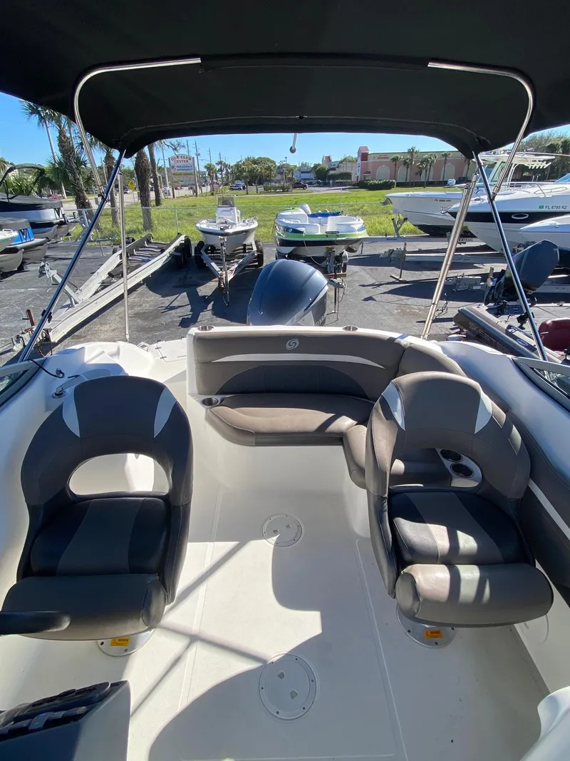 Slide: The Image of 2017 Hurricane SunDeck 2200 DC OB boat interior with seating and canopy. - 15