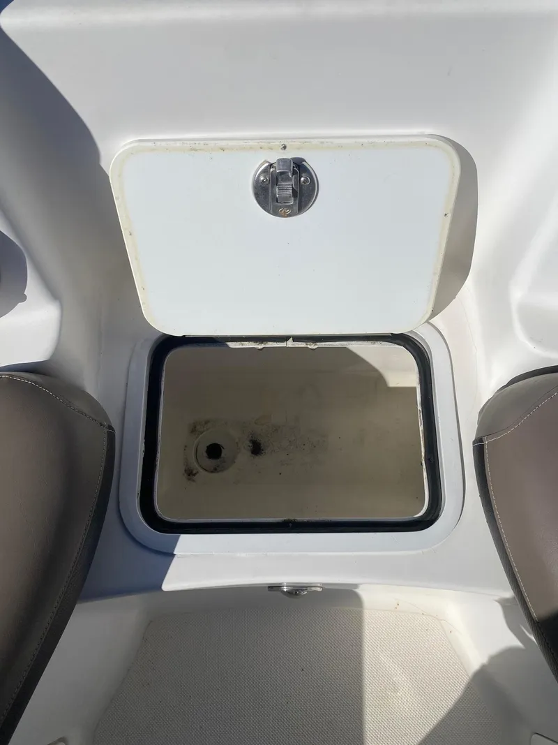 Slide: The Image of 2017 Hurricane SunDeck 2200 DC OB storage compartment with open hatch. - 22