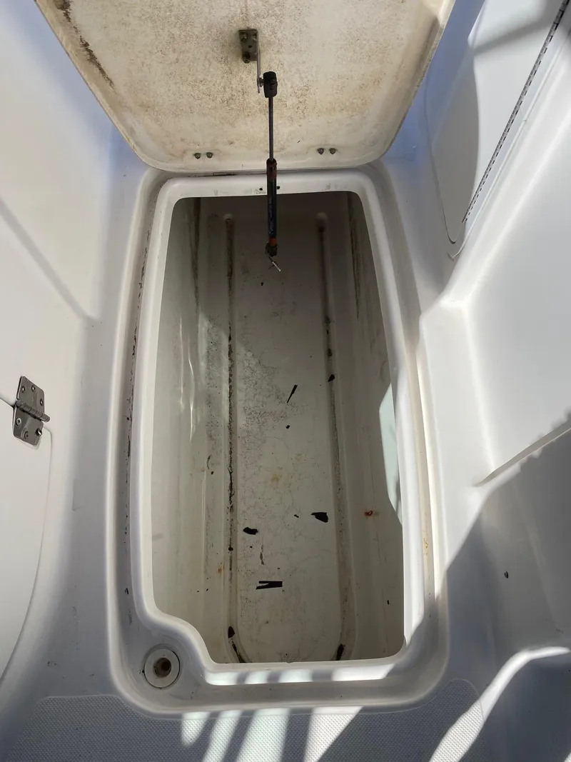 Slide: The Image of Open storage compartment of a 2017 Hurricane SunDeck 2200 DC OB boat. - 26