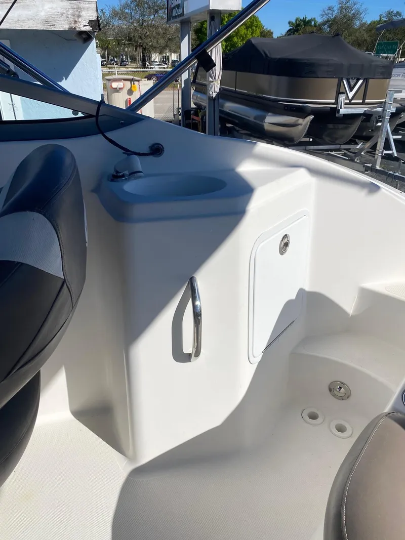 Slide: The Image of 2017 Hurricane SunDeck 2200 DC OB boat interior with sink and storage compartment. - 27