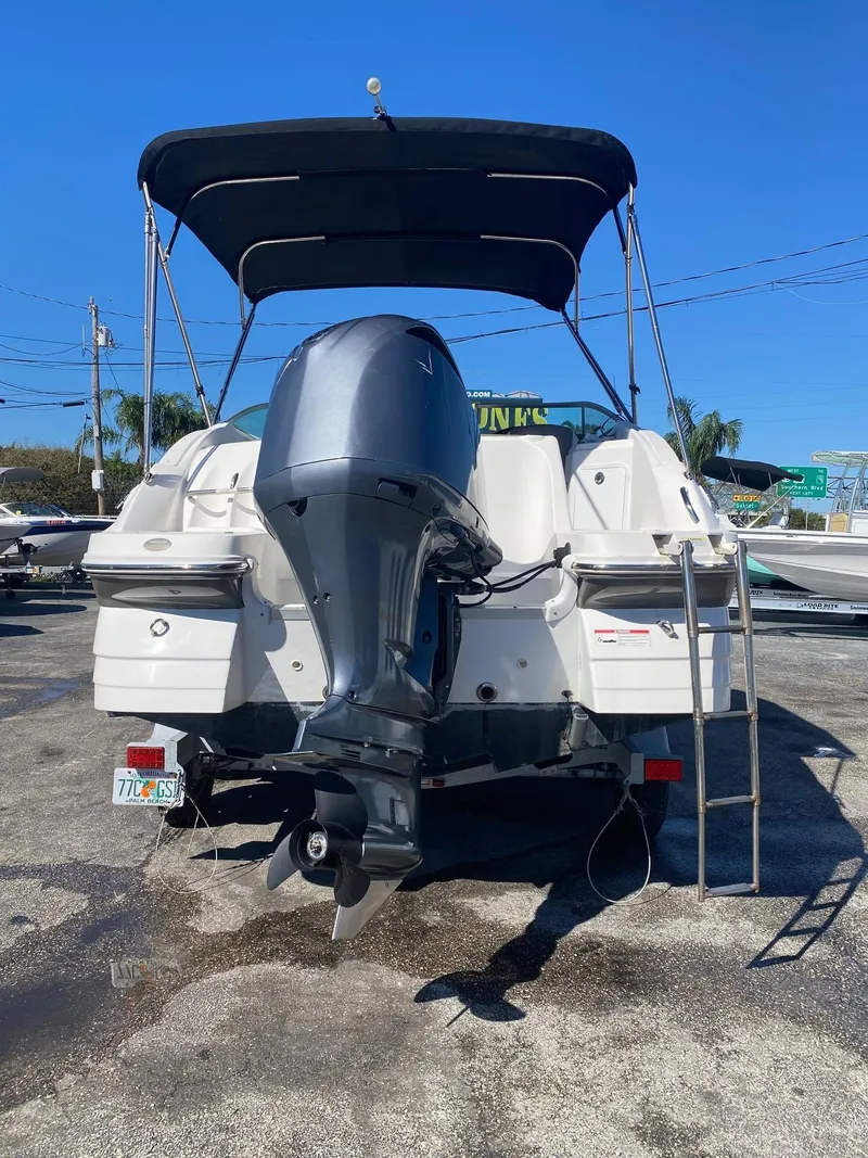 Slide: The Image of 2017 Hurricane SunDeck 2200 DC OB boat with outboard motor and canopy. - 3