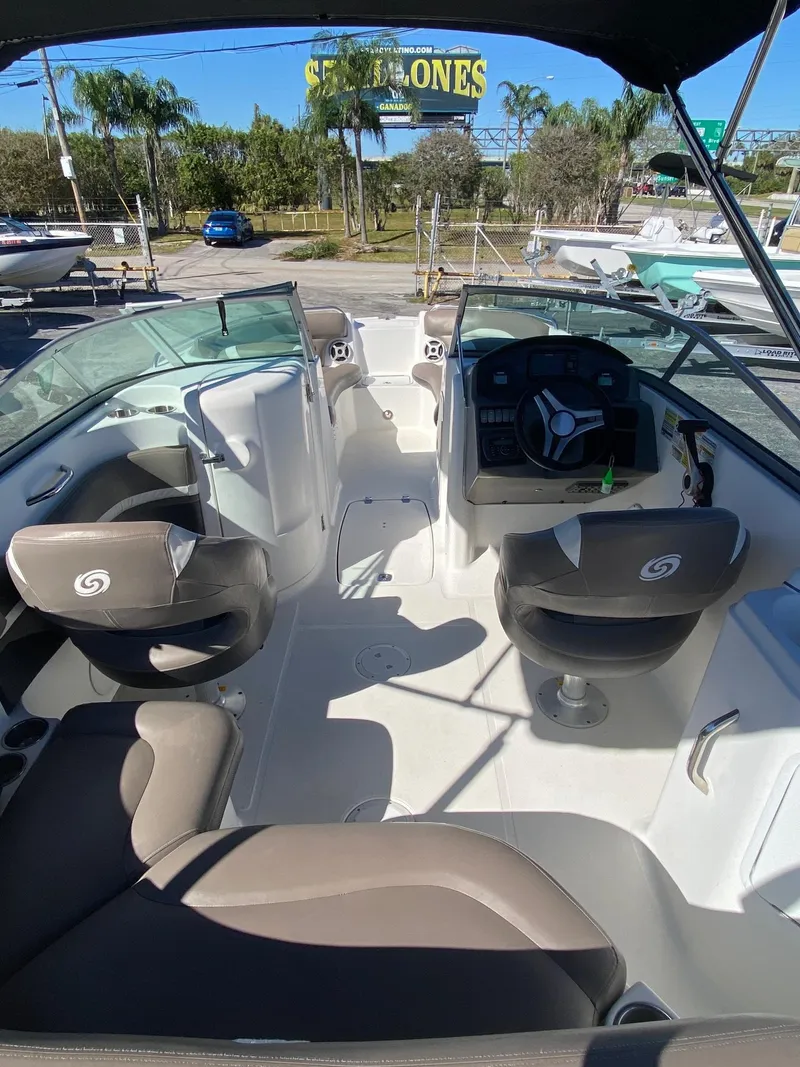 Slide: The Image of 2017 Hurricane SunDeck 2200 DC OB boat interior with seating and steering console. - 4