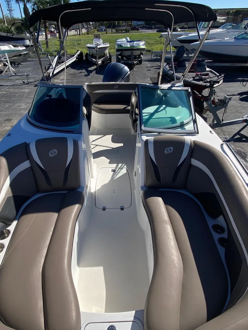 Slide: The Image of 2017 Hurricane SunDeck 2200 DC OB boat interior with seating and windshield. - 5