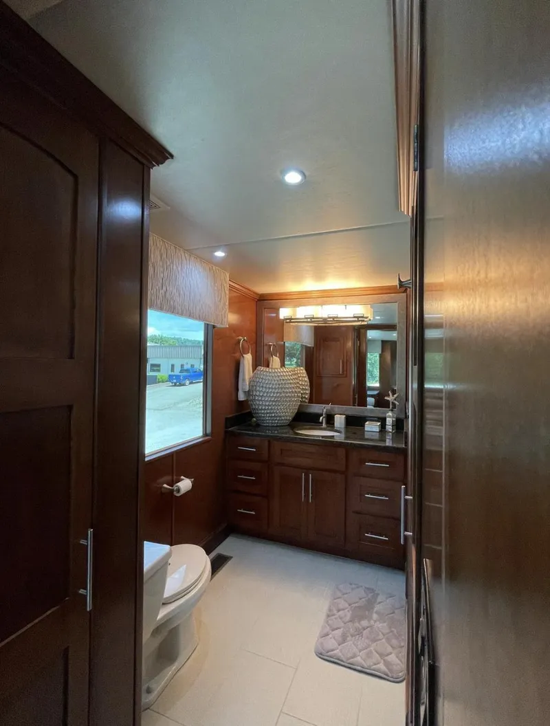 Slide: The Image of Luxurious bathroom in 2015 Stardust Cruisers 20' x 106' houseboat. - 15