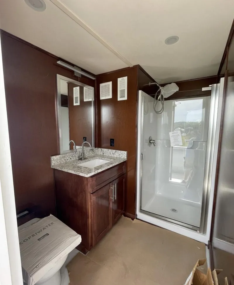 Slide: The Image of Modern bathroom in a 2015 Stardust Cruisers 20' x 106' houseboat. - 16