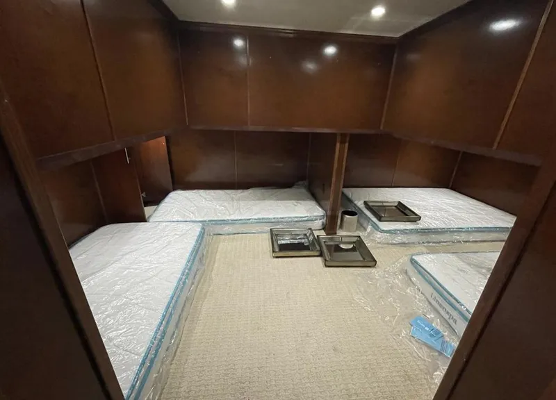 Slide: The Image of 2015 Stardust Cruisers 20' x 106' houseboat bedroom with four twin beds. - 18