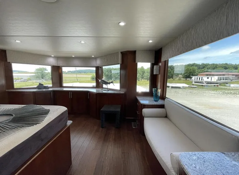 Slide: The Image of Luxurious interior of 2015 Stardust Cruisers 20' x 106' houseboat with panoramic windows. - 7