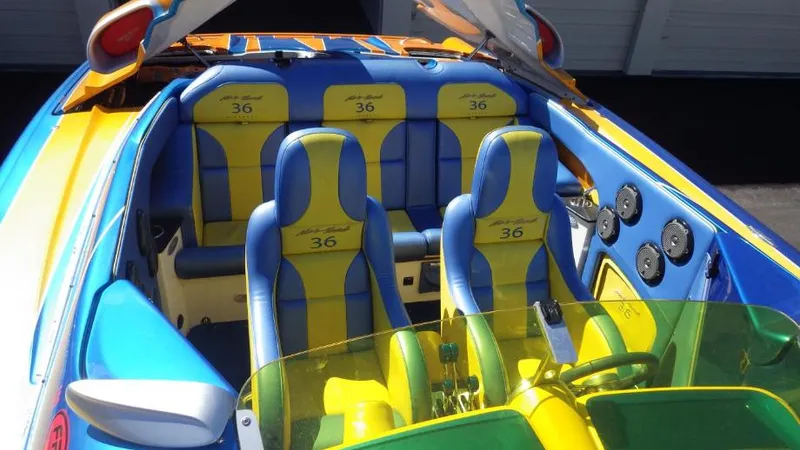 Slide: The Image of 2007 Nor-Tech 3600 Supercat with vibrant blue and yellow interior. - 5