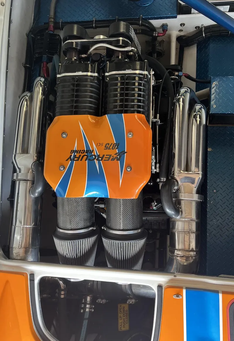 Slide: The Image of 2007 Nor-Tech 3600 Supercat engine with orange and blue cover. - 8