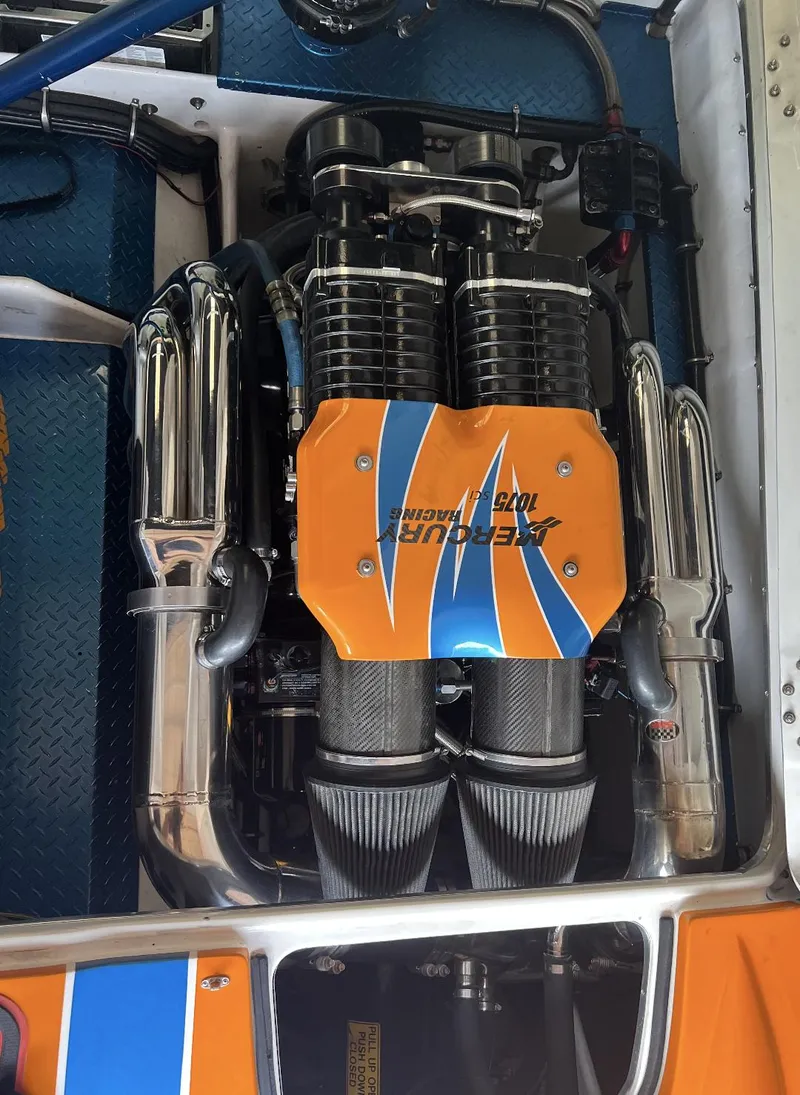 Slide: The Image of 2007 Nor-Tech 3600 Supercat engine with custom orange and blue cover. - 9
