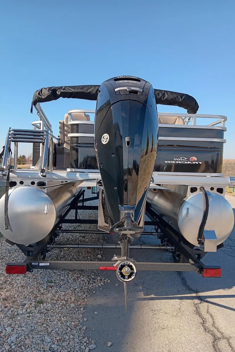 Slide: The Image of 2024 Sun Tracker SportFish 20 DLX pontoon boat rear view. - 2