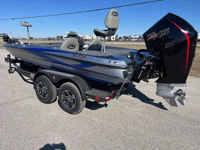 Slide: The Image of 2024 Triton 19 TrX Patriot bass boat with Mercury 225 Pro XS engine. - 1