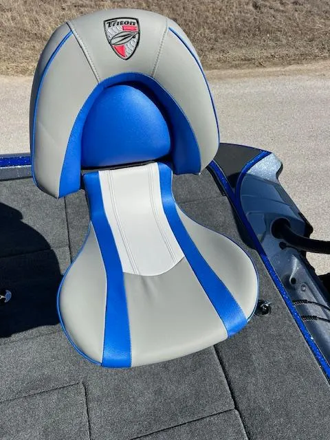 Slide: The Image of 2024 Triton 19 TrX Patriot boat seat with blue and gray upholstery. - 7