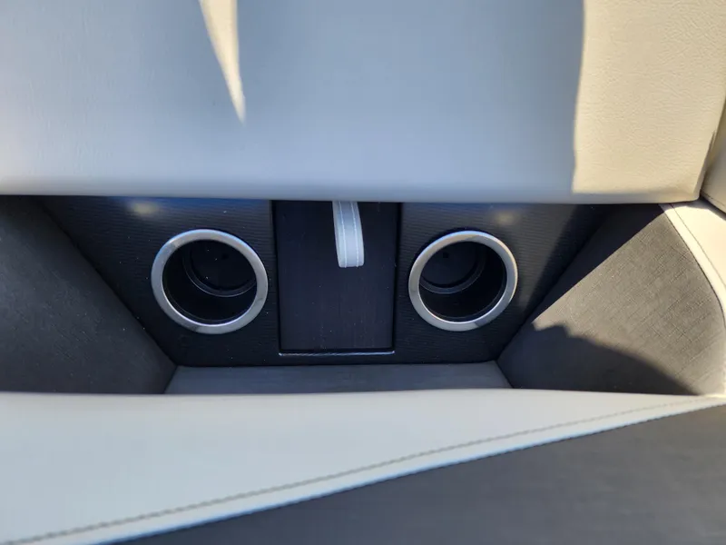 Slide: The Image of Close-up of 2024 Trifecta 24RF LE 2 75 cup holders and storage compartment. - 11