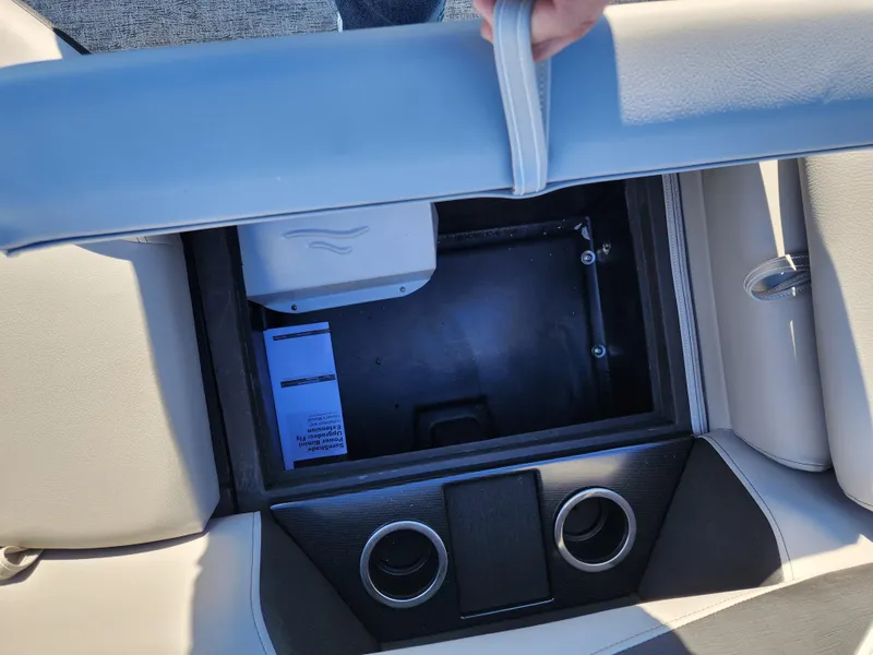 Slide: The Image of 2024 Trifecta 24RF LE 2 75 boat storage compartment with cup holders. - 12