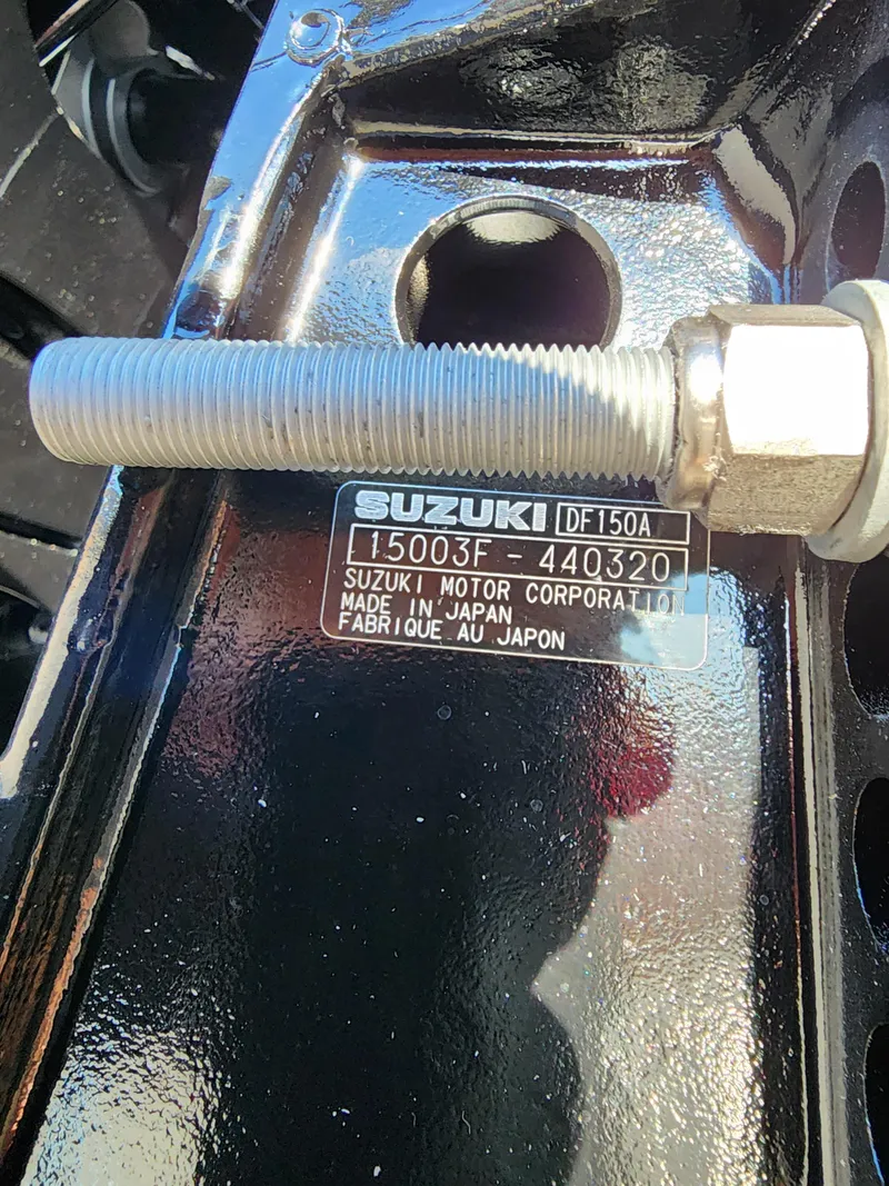 Slide: The Image of 2024 Trifecta 24RF LE 2 75 w trailer featuring Suzuki DF150A motor, made in Japan. - 2