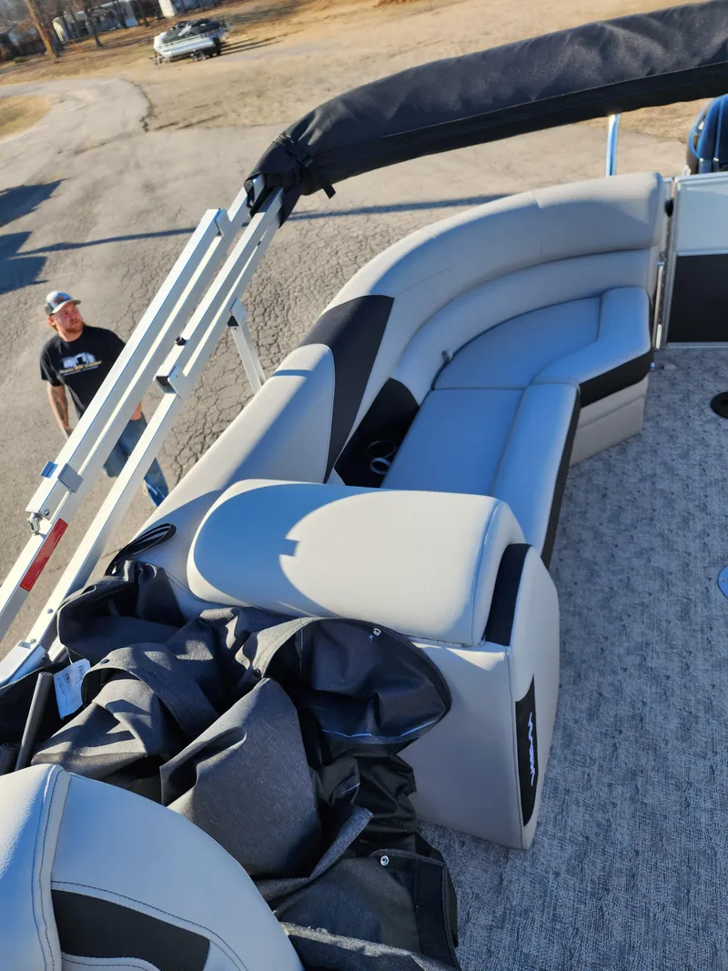 Slide: The Image of 2024 Trifecta 24RF LE 2 75 pontoon boat with trailer, featuring spacious seating. - 21