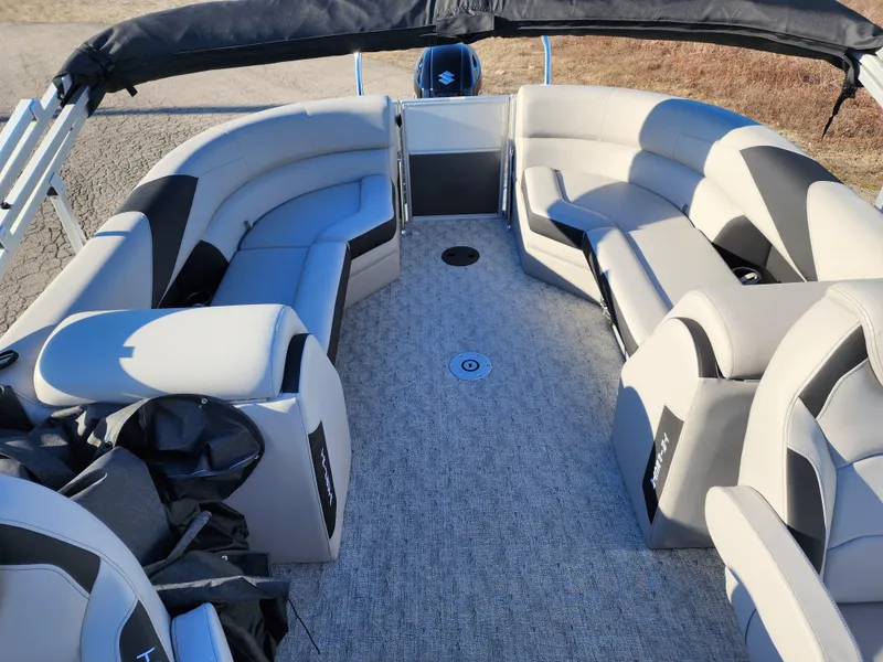 Slide: The Image of 2024 Trifecta 24RF LE 2 75 pontoon boat interior with trailer. - 22