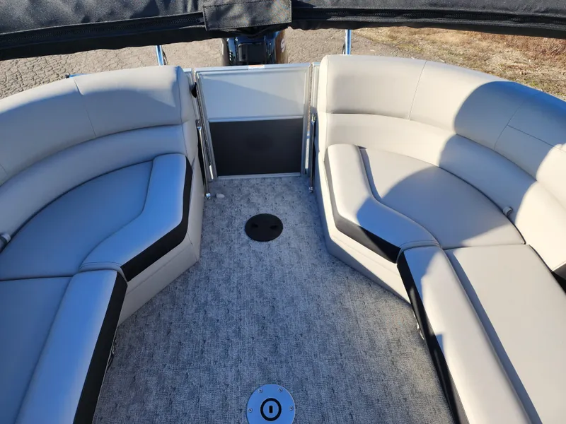 Slide: The Image of 2024 Trifecta 24RF LE 2 75 pontoon boat interior with plush seating. - 23