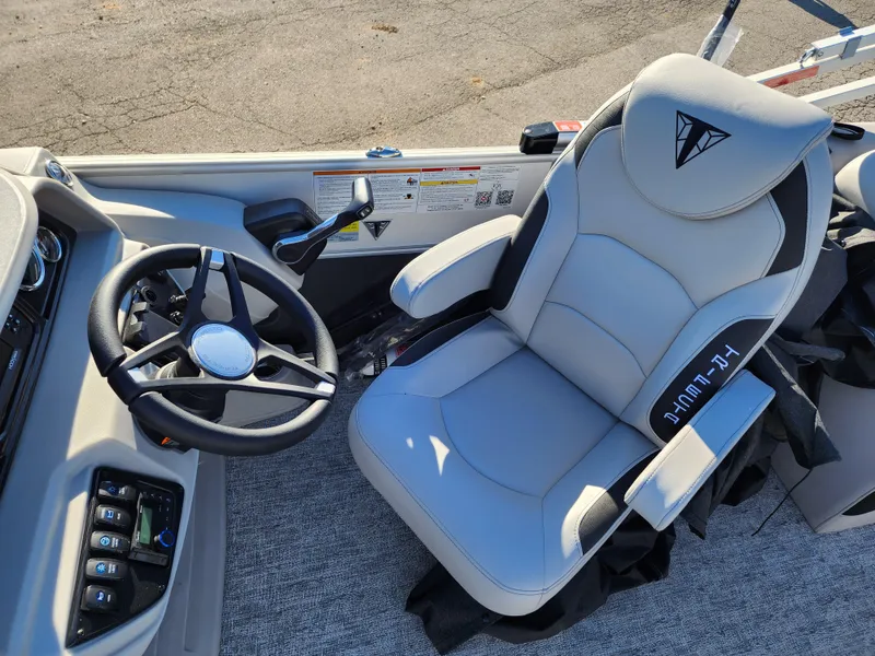 Slide: The Image of Captain's chair and steering wheel of 2024 Trifecta 24RF LE 2 75 pontoon boat. - 25