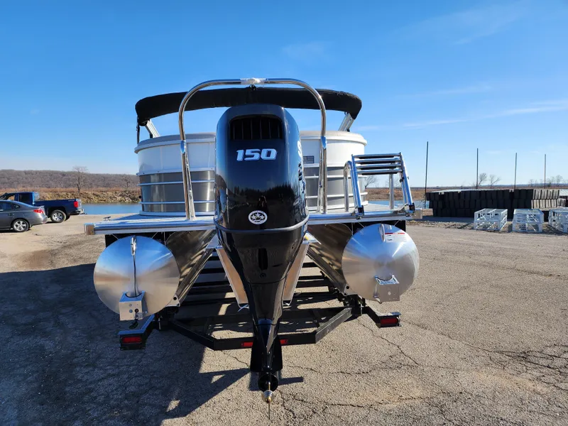 Slide: The Image of 2024 Trifecta 24RF LE 2 75 pontoon boat with trailer, rear view. - 4