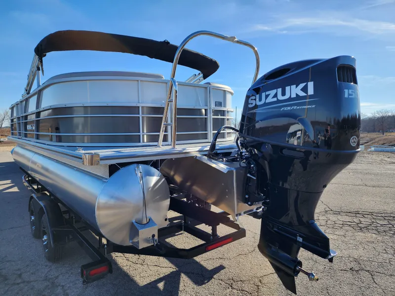 Slide: The Image of 2024 Trifecta 24RF LE 2 75 pontoon boat with Suzuki 150 outboard motor and trailer. - 5