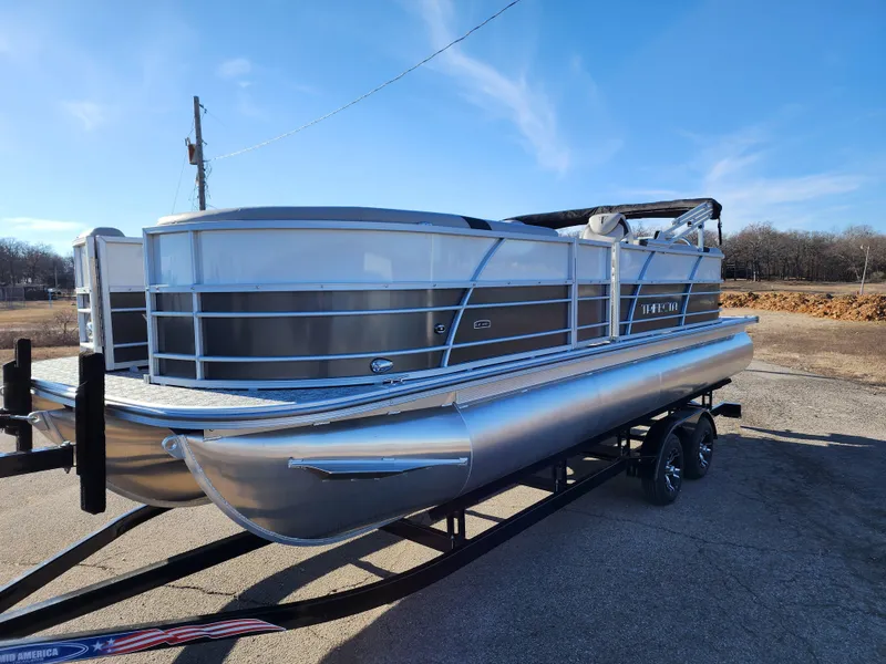 Slide: The Image of 2024 Trifecta 24RF LE 2 75 pontoon boat with trailer in a parking lot. - 7