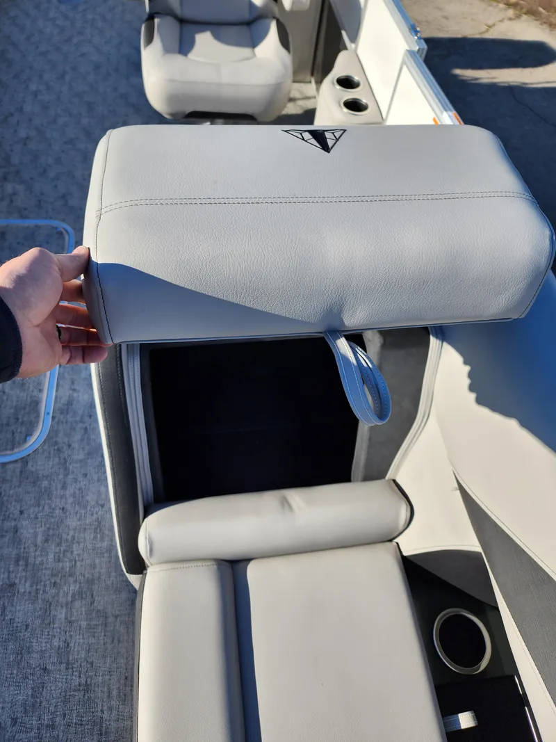 Slide: The Image of 2024 Trifecta 24RF LE 2 75 boat with trailer, featuring spacious seating and storage compartments. - 9