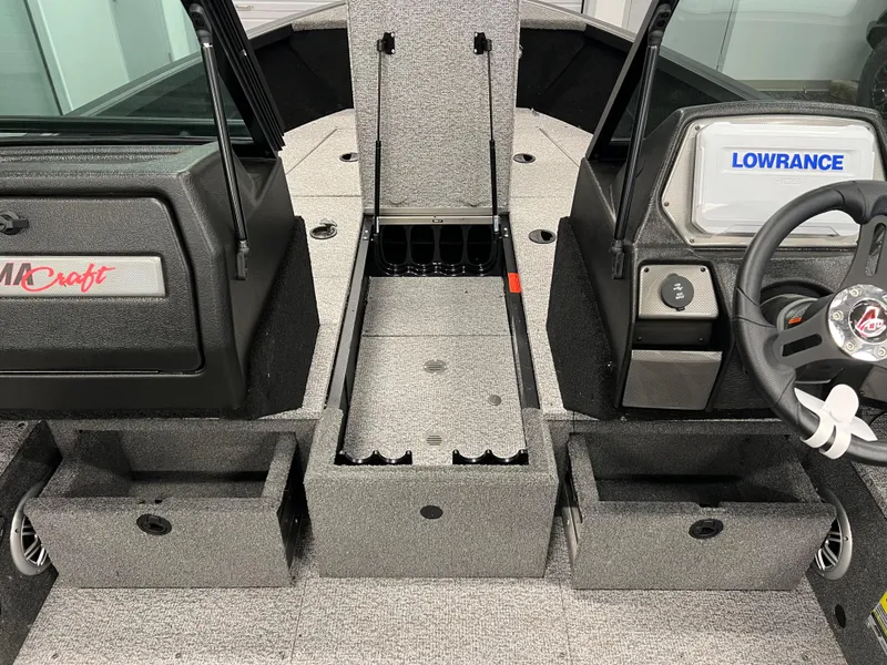 Slide: The Image of 2023 Alumacraft Competitor 175 Sport interior with Lowrance system and storage compartments. - 12