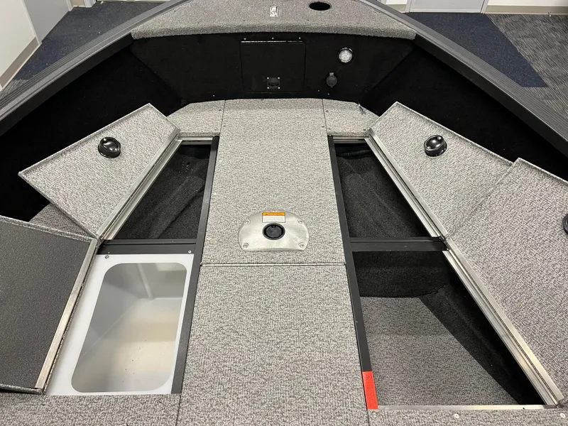 Slide: The Image of 2023 Alumacraft Competitor 175 Sport boat interior with storage compartments and livewell. - 14