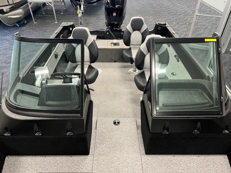 Slide: The Image of 2023 Alumacraft Competitor 175 Sport boat interior with dual consoles and seating. - 15