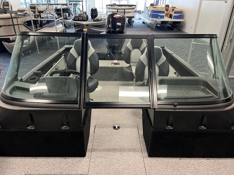 Slide: The Image of 2023 Alumacraft Competitor 175 Sport boat interior with seating and windshield. - 16