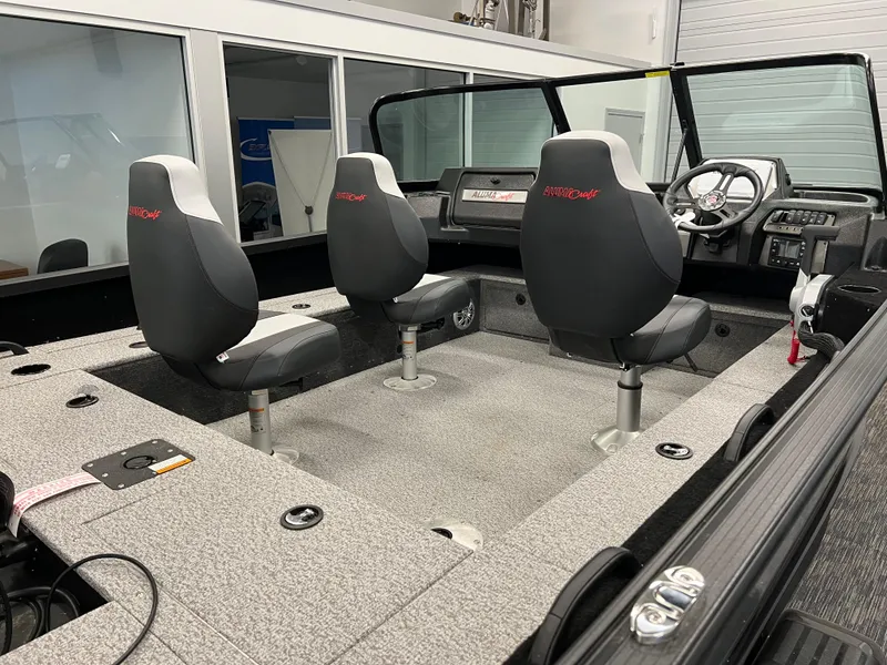 Slide: The Image of 2023 Alumacraft Competitor 175 Sport interior with two seats and dashboard. - 17