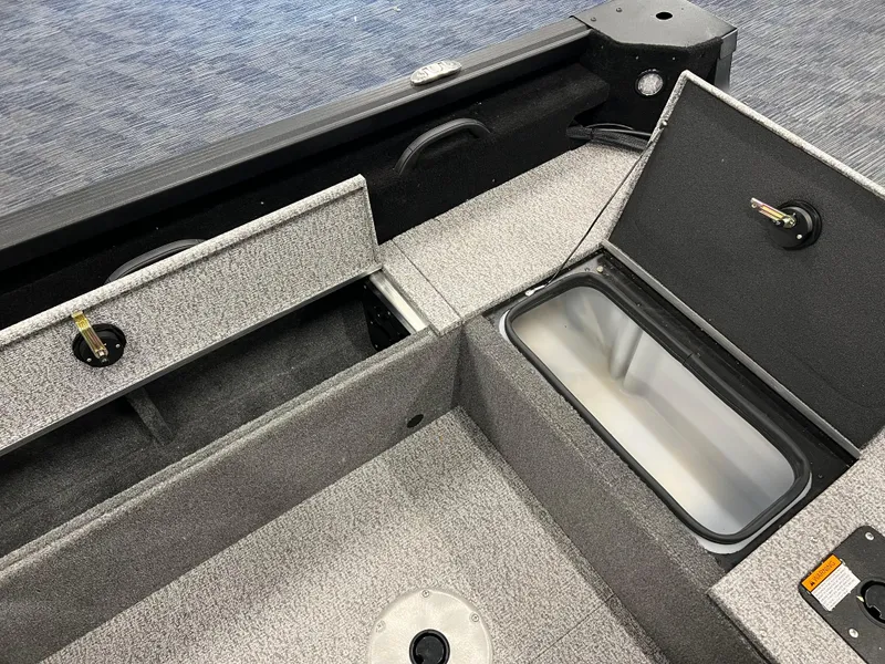 Slide: The Image of 2023 Alumacraft Competitor 175 Sport boat interior with storage compartments. - 5