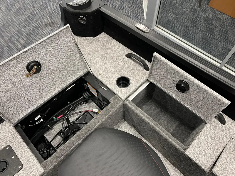 Slide: The Image of 2023 Alumacraft Competitor 175 Sport boat storage compartments and seating area. - 7