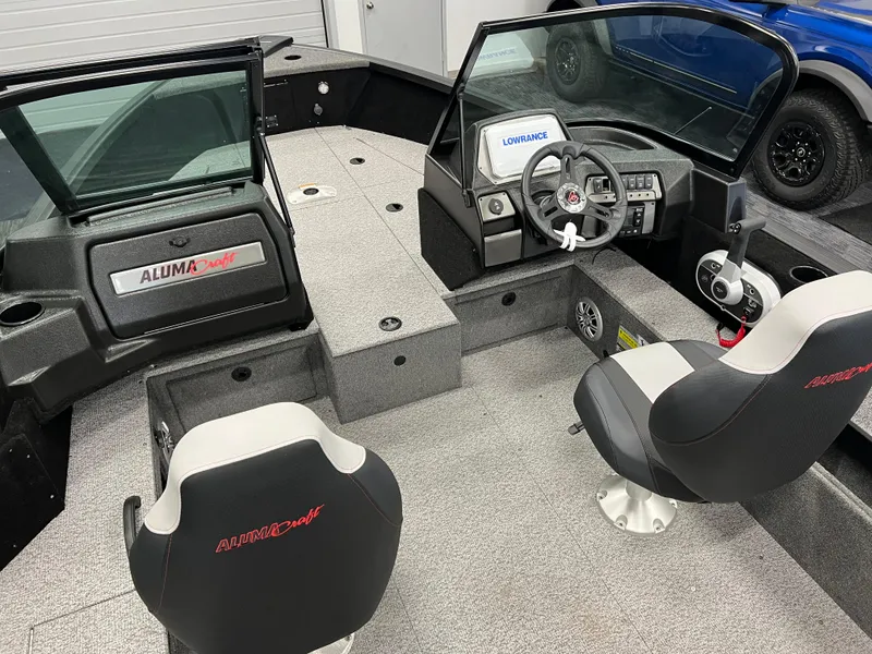 Slide: The Image of 2023 Alumacraft Competitor 175 Sport interior with dual seats and modern dashboard. - 8