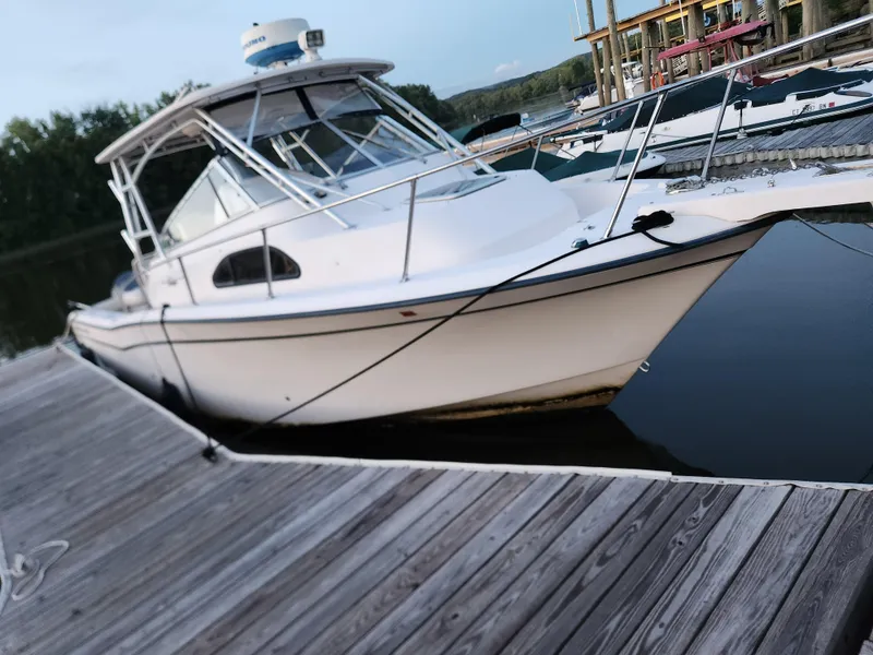 Slide: The Image of 2005 Grady-White Marlin 300 boat docked at marina. - 1