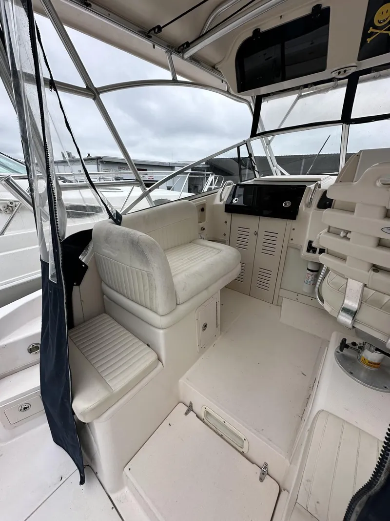 Slide: The Image of 2005 Grady-White Marlin 300 boat interior with seating and helm station. - 10