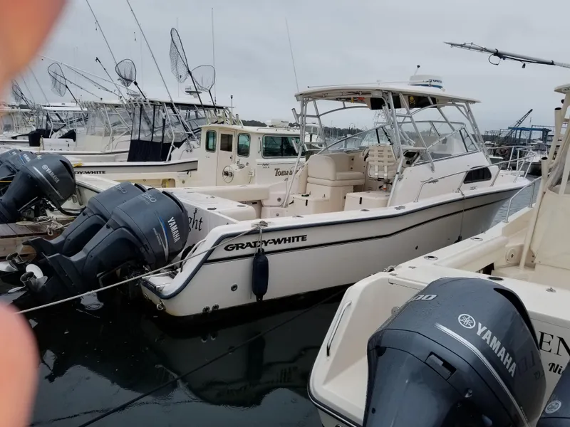 Slide: The Image of 2005 Grady-White Marlin 300 boat docked with Yamaha outboard engines. - 2