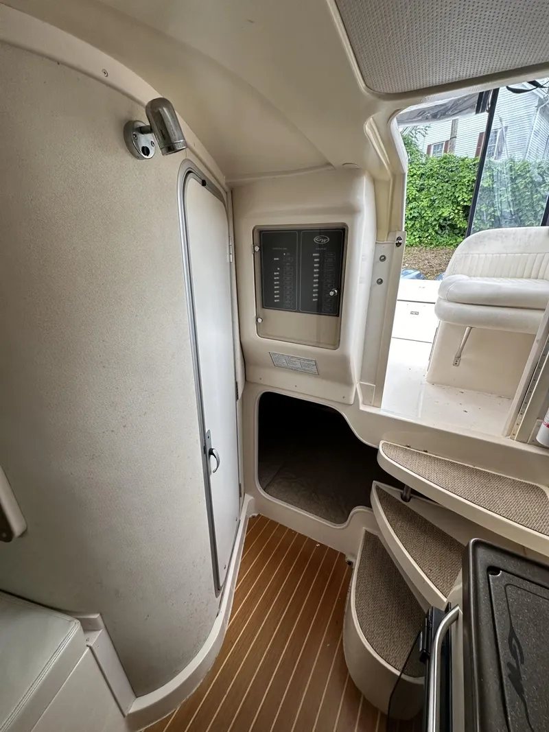 Slide: The Image of 2005 Grady-White Marlin 300 cabin interior with stairs and control panel. - 20