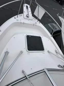 Slide: The Image of 2005 Grady-White Marlin 300 boat deck with hatch and railing. - 26