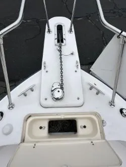 Slide: The Image of 2005 Grady-White Marlin 300 boat deck with anchor chain and storage compartment. - 27