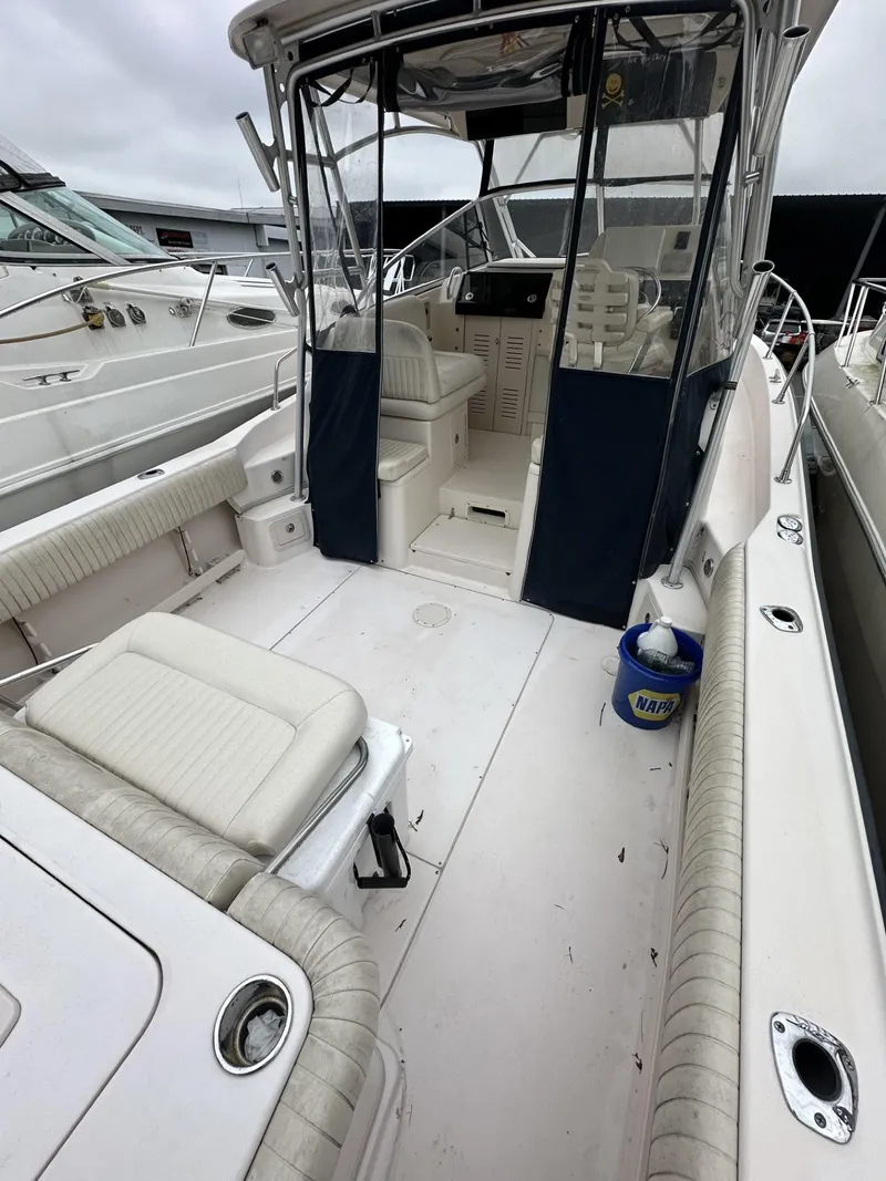 Slide: The Image of 2005 Grady-White Marlin 300 boat interior with seating and helm area. - 5