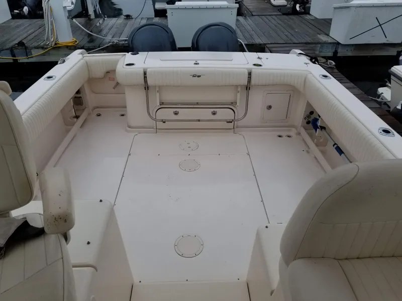 Slide: The Image of 2005 Grady-White Marlin 300 boat interior with spacious seating and storage. - 8