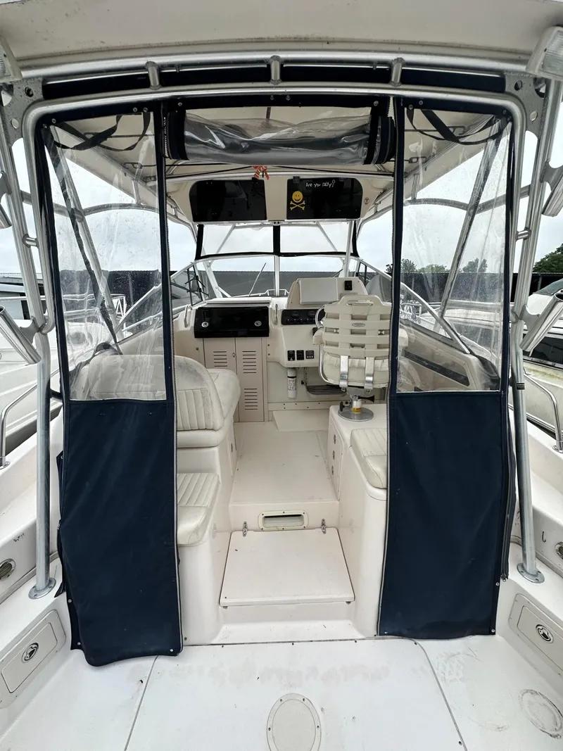 Slide: The Image of 2005 Grady-White Marlin 300 boat interior with seating and helm station. - 9