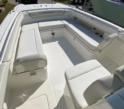 Slide: The Image of 2024 World Cat 280 CC-X boat interior with white cushioned seating. - 10